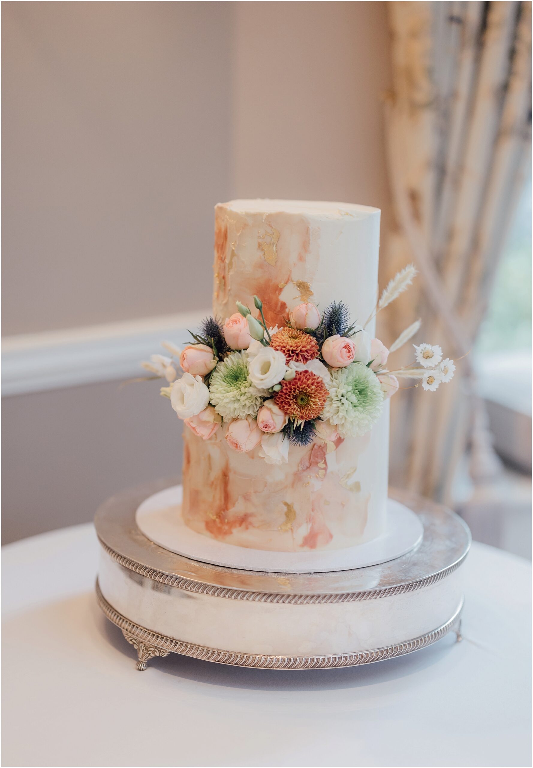 peach-wedding-cake-with-fresh flowers-kerry