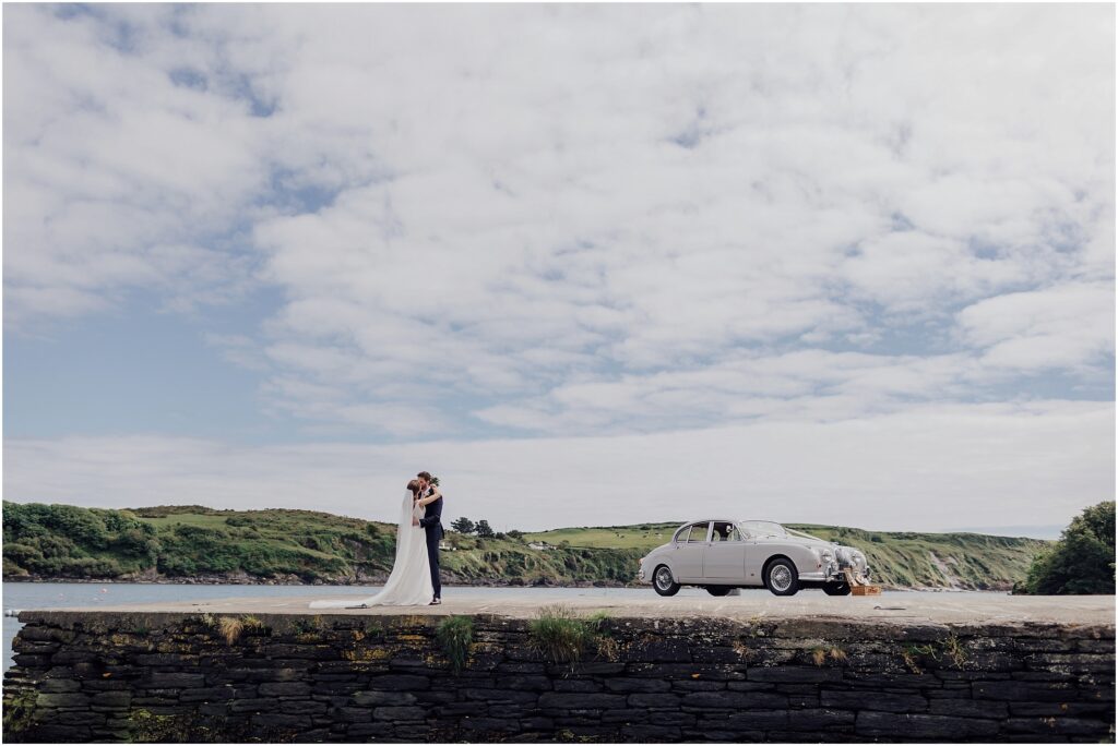 couple-photographs-on-pier-in-cork